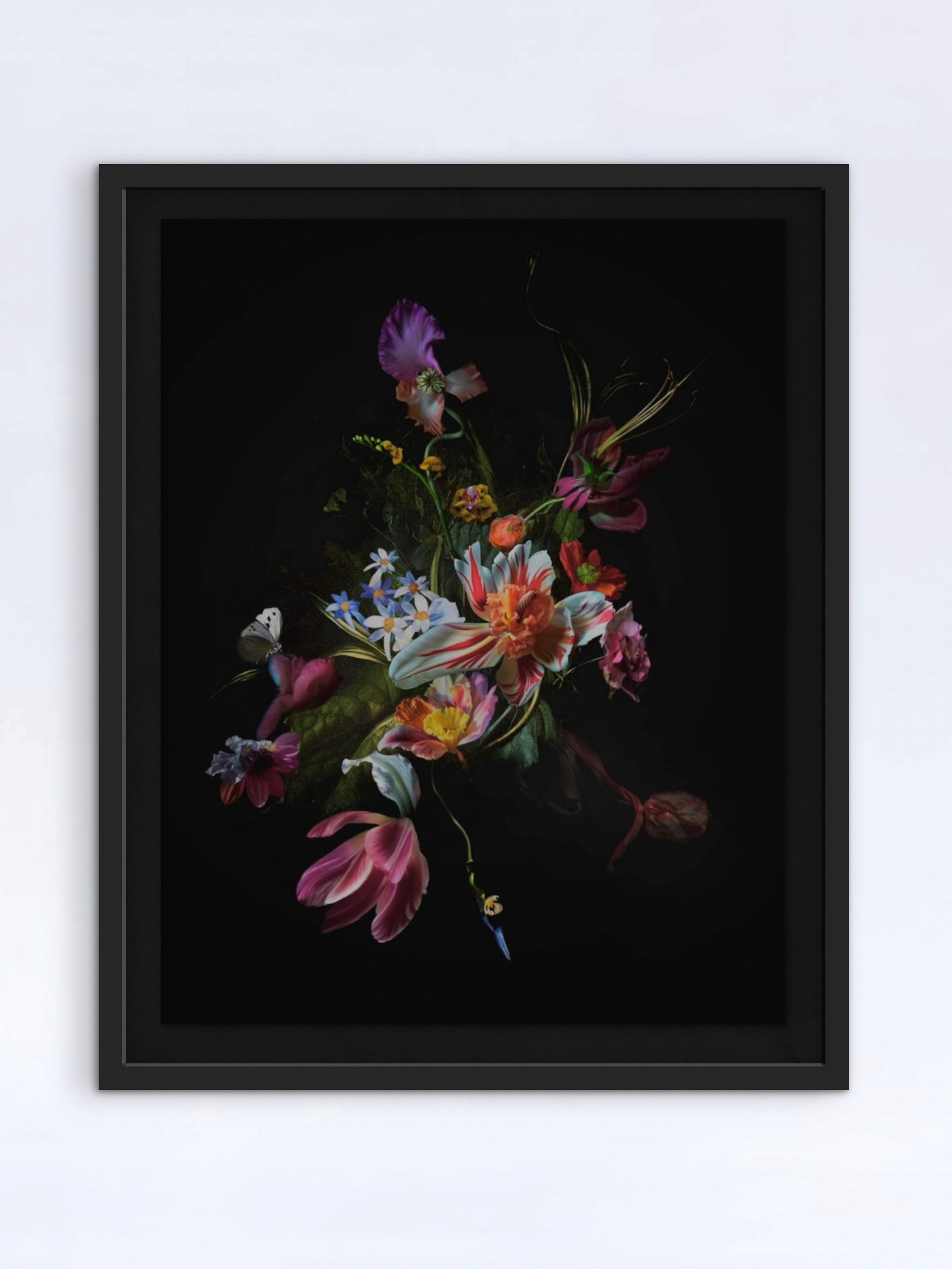 A framed print by Brady Krafts from the Passage-series, here visualised framed in a black frame with a floating mount. The bouquet is made up of colourful flower like hybrid species on a solid black background